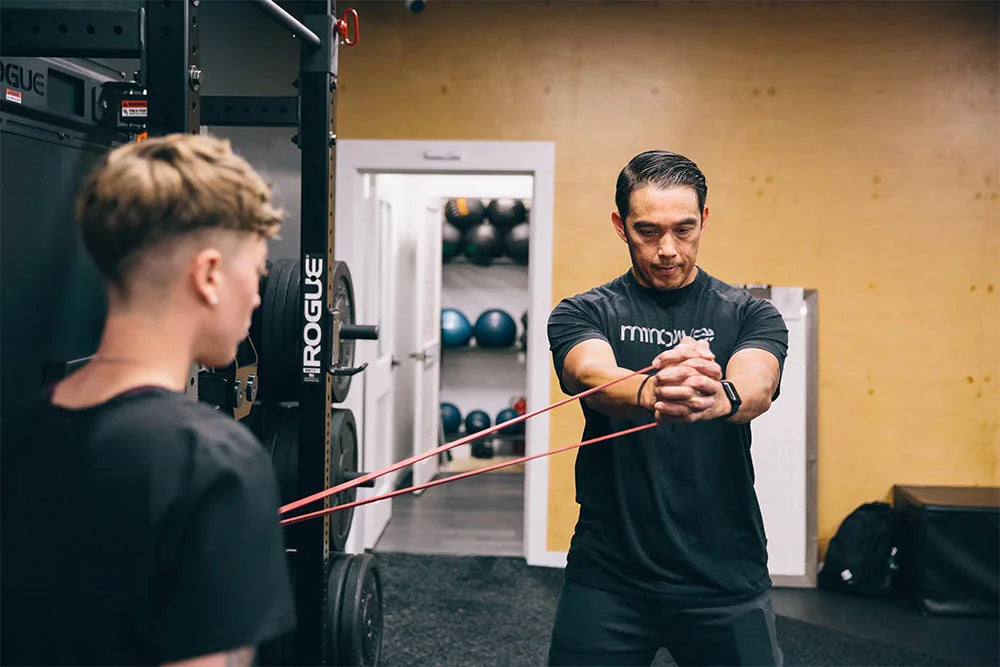 Image of man working on arm strength training excesises